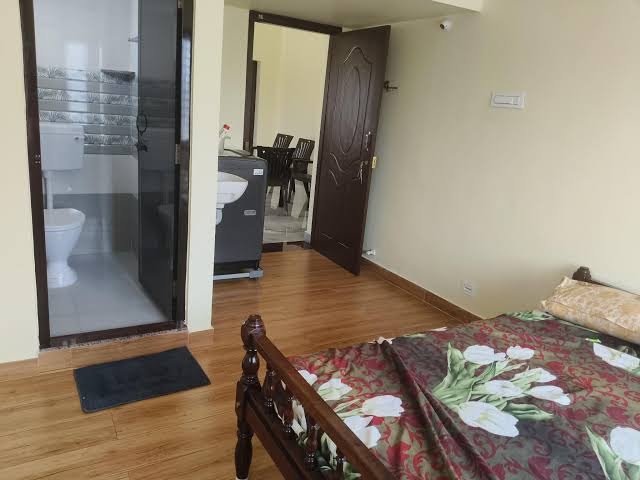 Bedroom with wooden wardrobe and bed
